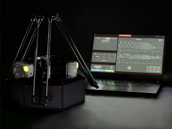 Industrial robot connected to laptop with configuration interface